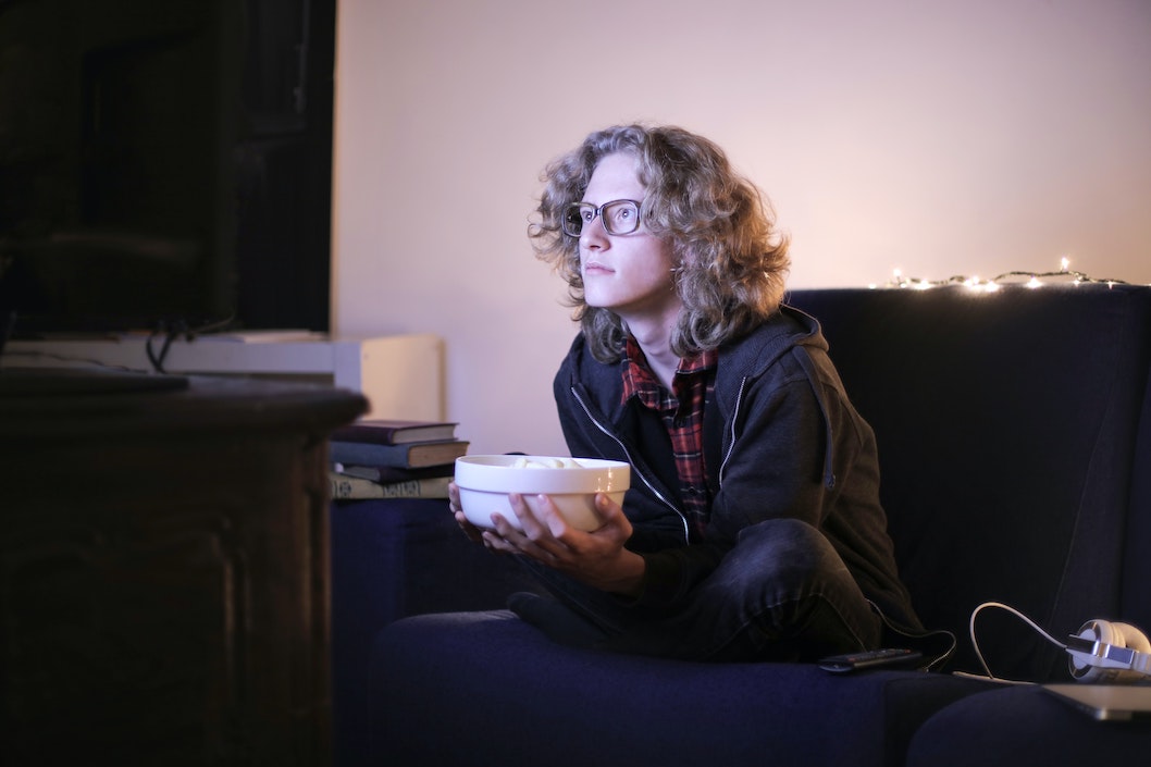 Indie Filmmaker watching indie films at home